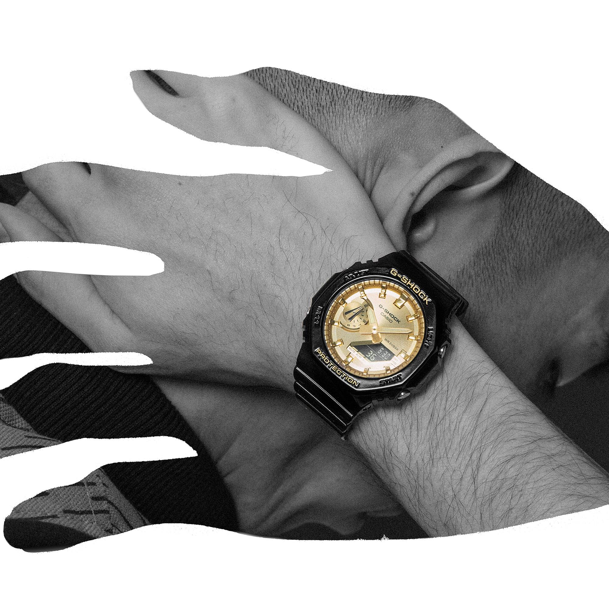 Hand silhouette of G-SHOCK GA-2100GB-1A Black and Gold analog-digital watch