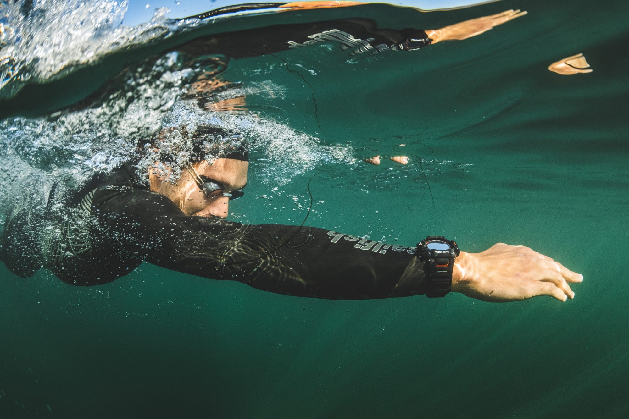 man wearing black G-SHOCK MOVE GBDH2000-1A swimming in the ocean man wearing black G-SHOCK MOVE GBDH2000-1A swimming in the ocean