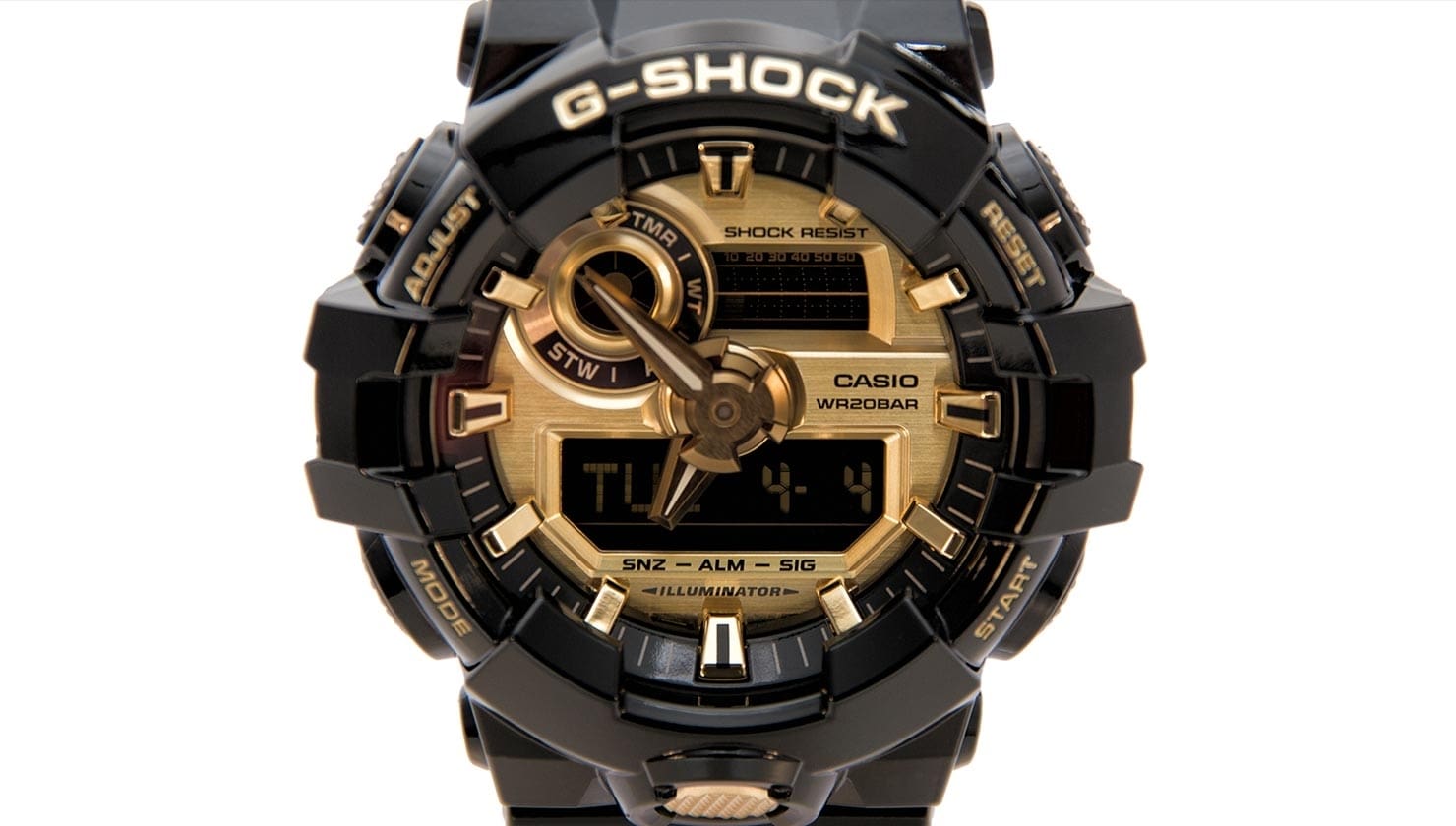 Detalle de la caja del reloj con esfera dorada e indicación digital de la fecha