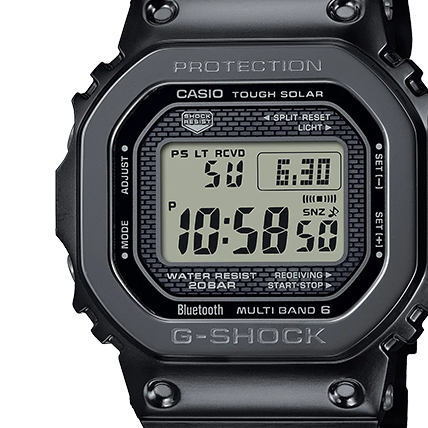 Close-up of the Eric Haze collaboration model with rectangular metal case, digital display and dark mural pattern in the background.