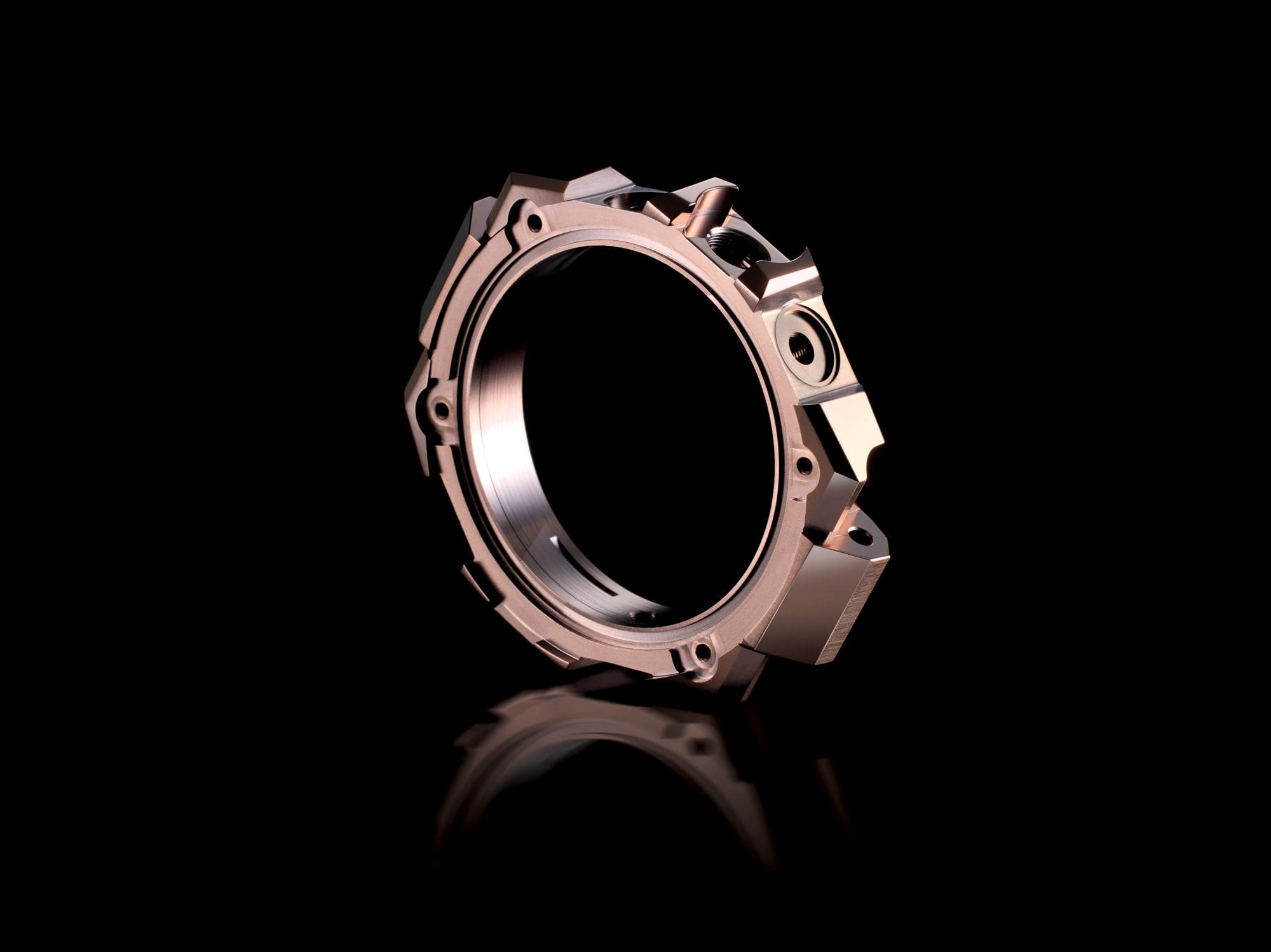 Copper-coloured part of the case in front of a black background