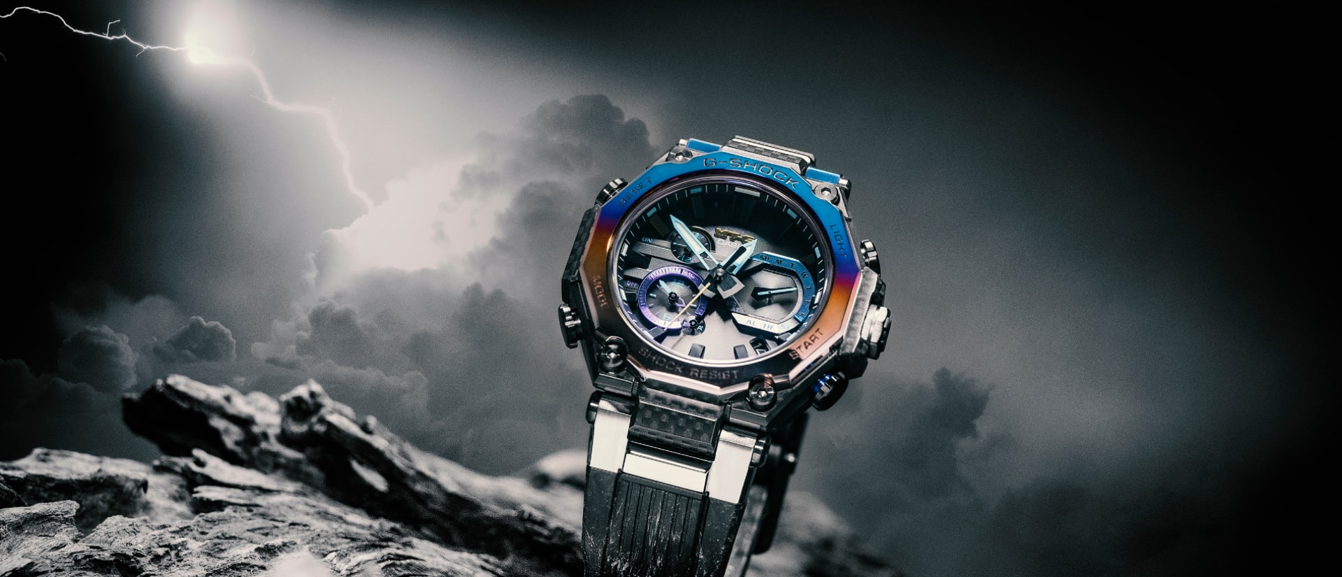 The MTG-B2000Yst-1AER on a dark grey thunderstorm background with coloured bezel