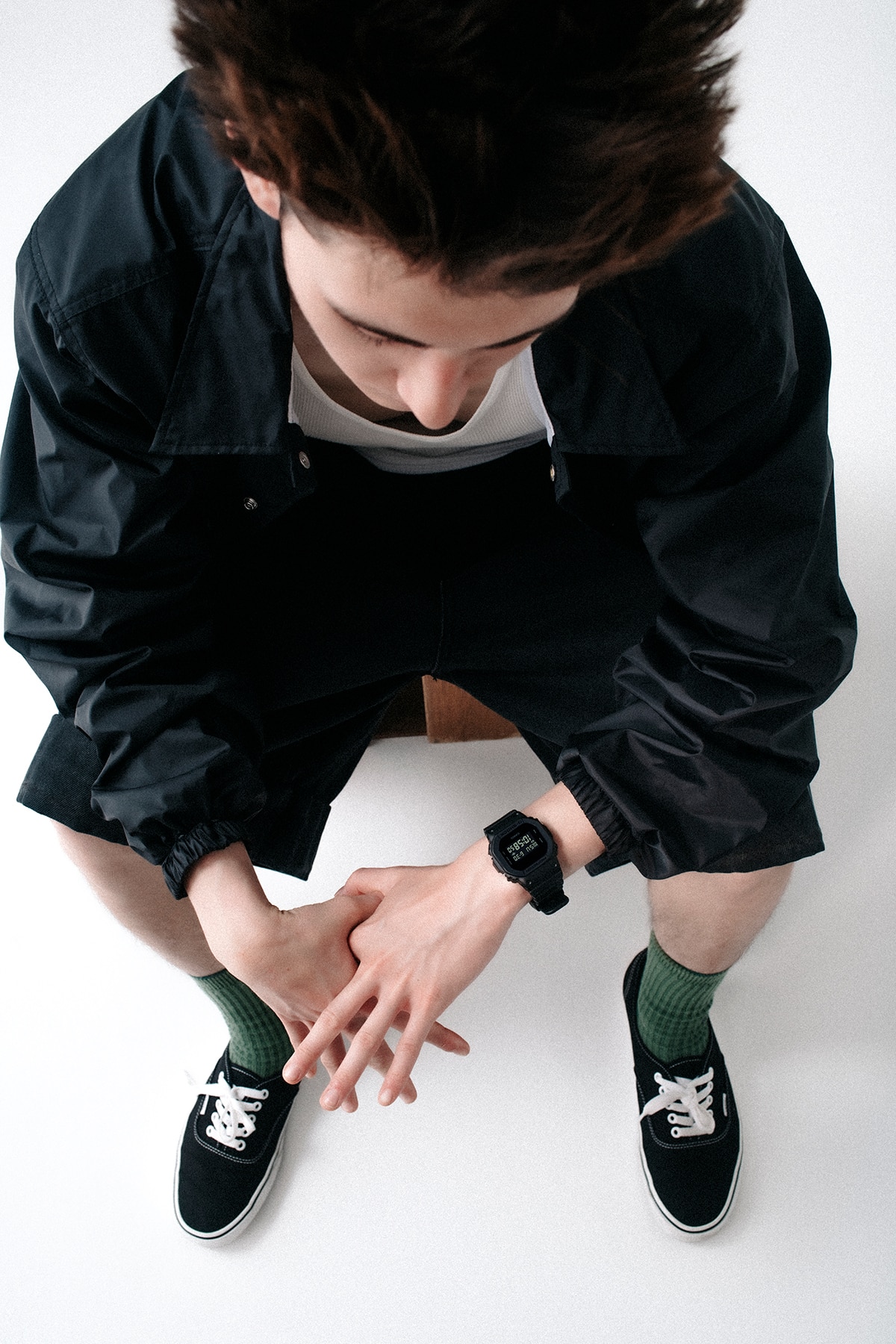 A man wearing a G-SHOCK DW-5600UBB watch on his wrist.