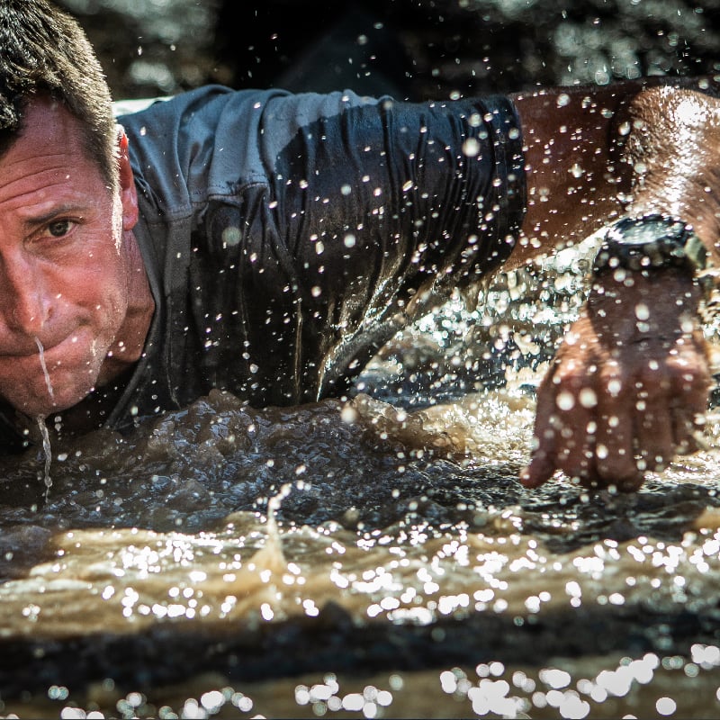 Military man in the water wearing G-SHOCK Mudmaster