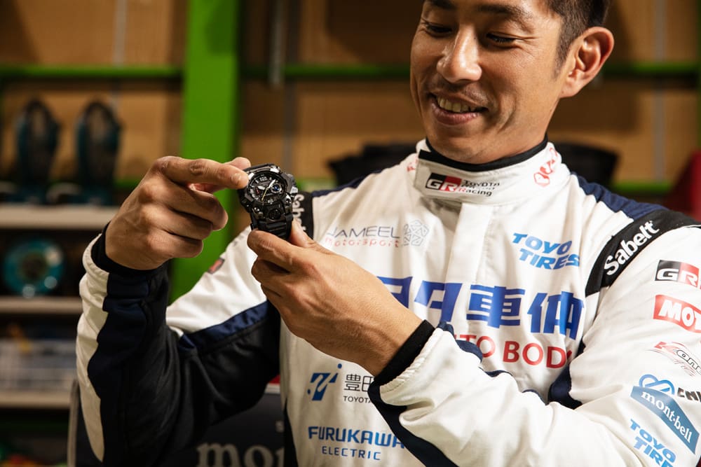 Miura Akira holds the G-SHOCK GWG-B1000TLC in both hands.