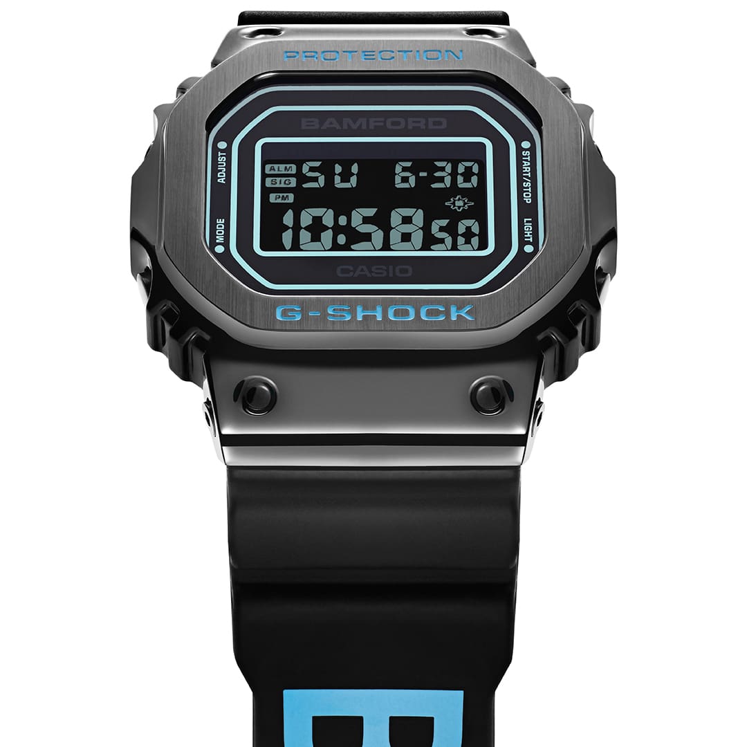 the GM-5600 and its distinctive metal bezel in all black as our base, featuring Bamford’s signature aqua blue throughout the design. 