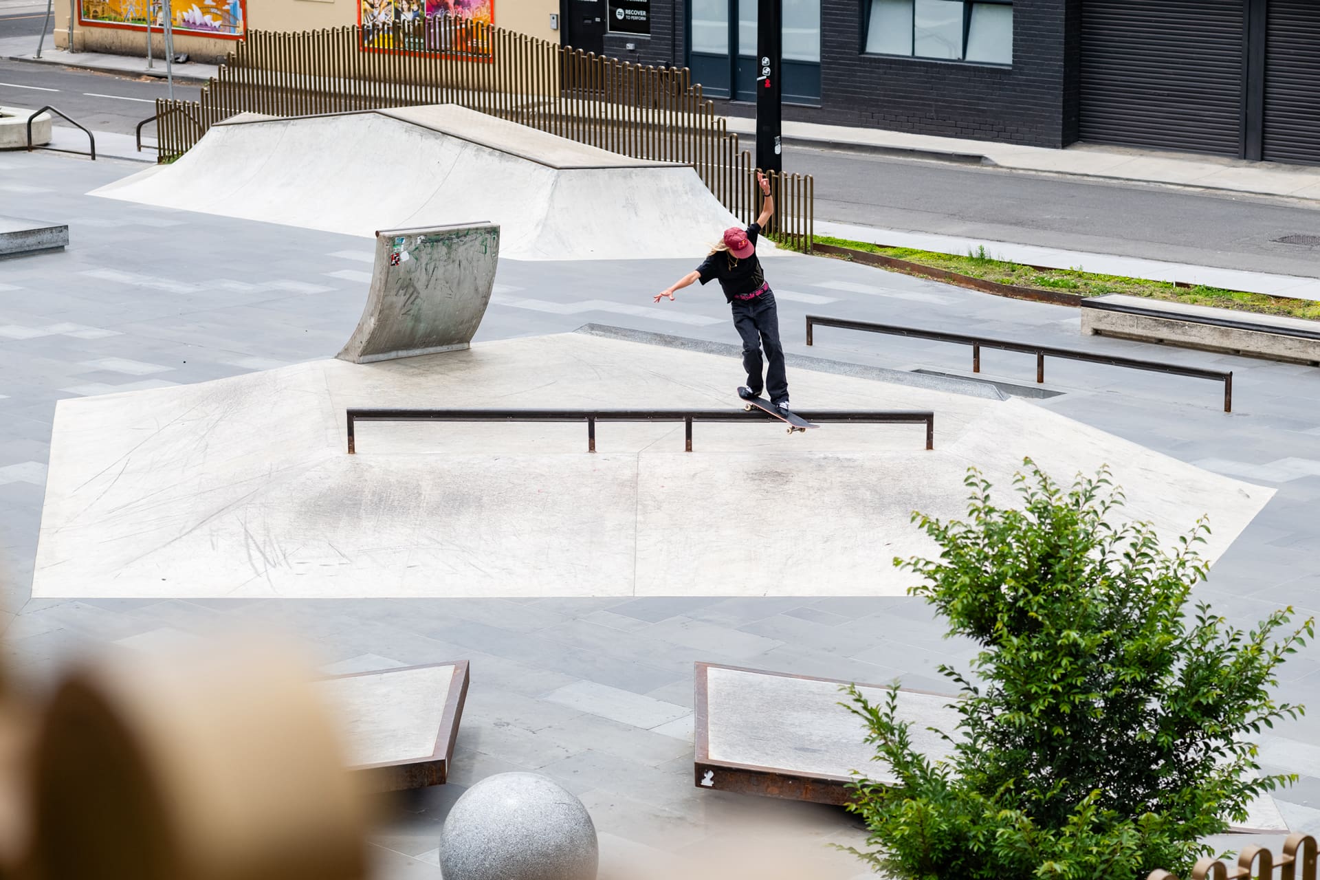 Close-up of brown G-SHOCK with pink digital display.