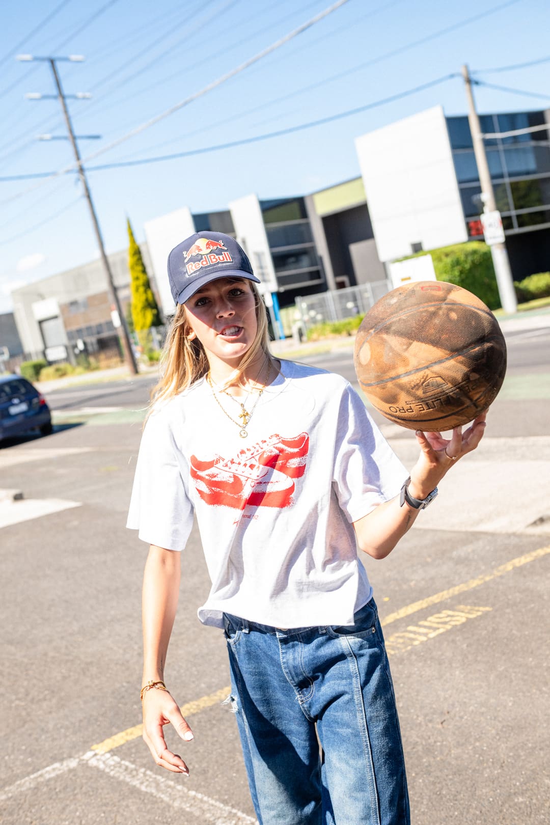 Rubi Rose lying beside large brown G-SHOCK.