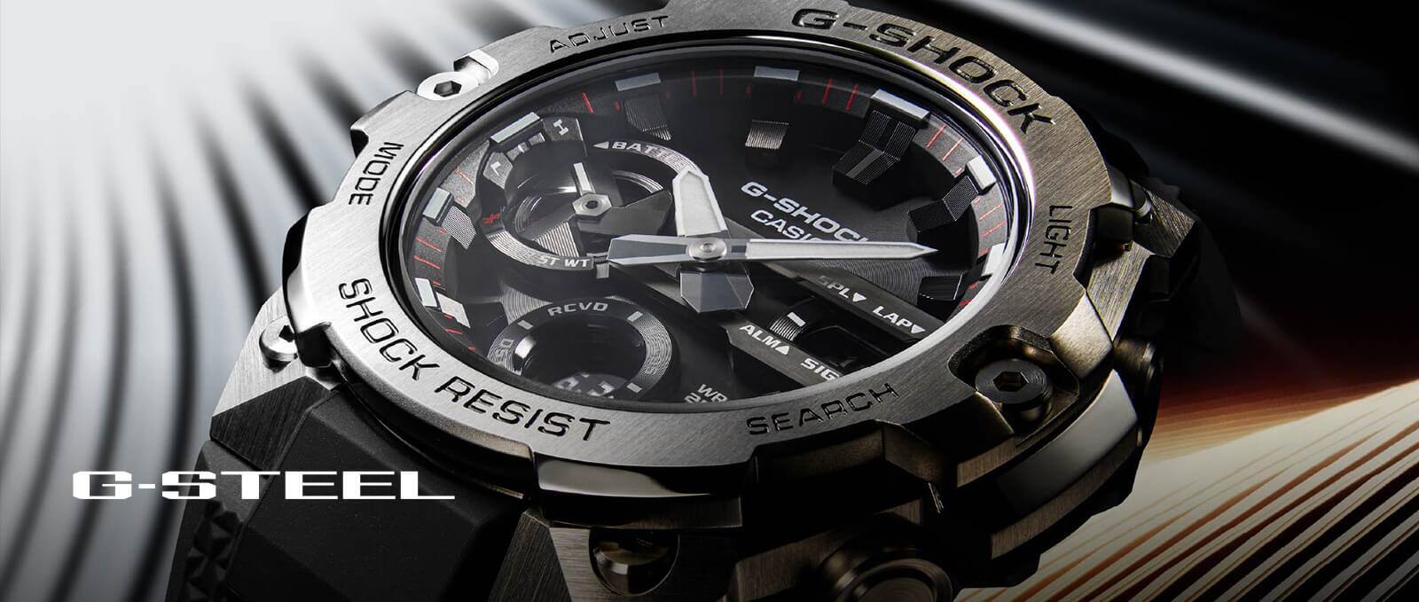 Primo piano dell'orologio da polso GST-B400 di G-SHOCK con lunetta in metallo, display analogico nero e cinturino in resina nera.