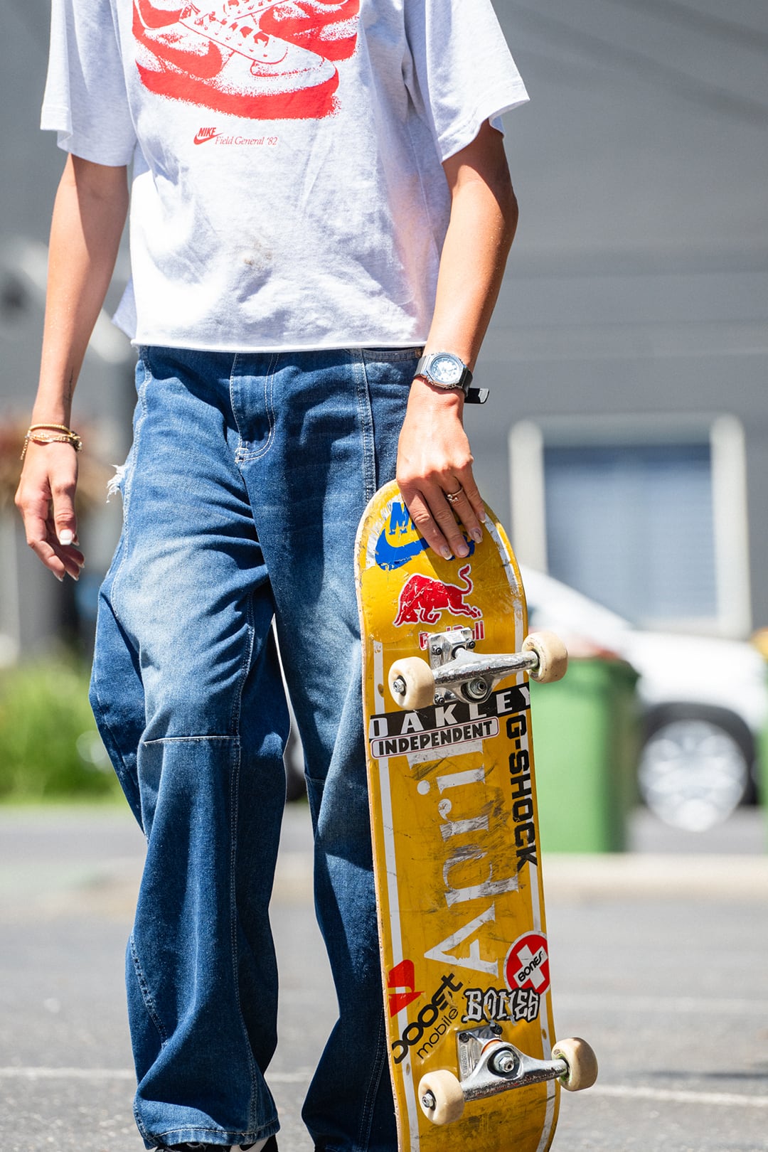 Rubi Rose lying beside large brown G-SHOCK.