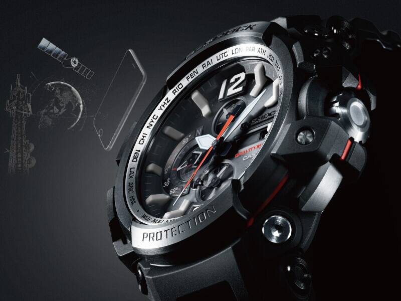 Analog Digital G-SHOCK watch with satellite and mobile device illustration in the background