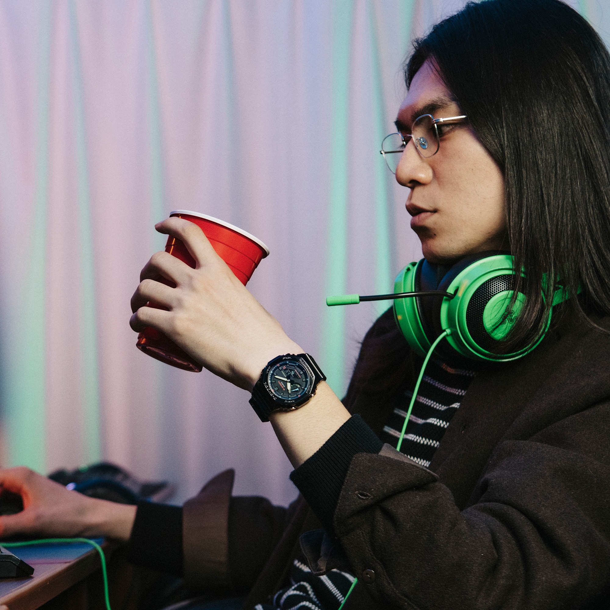 Gamer taking a break wearing GRB Gamer watch on wrist