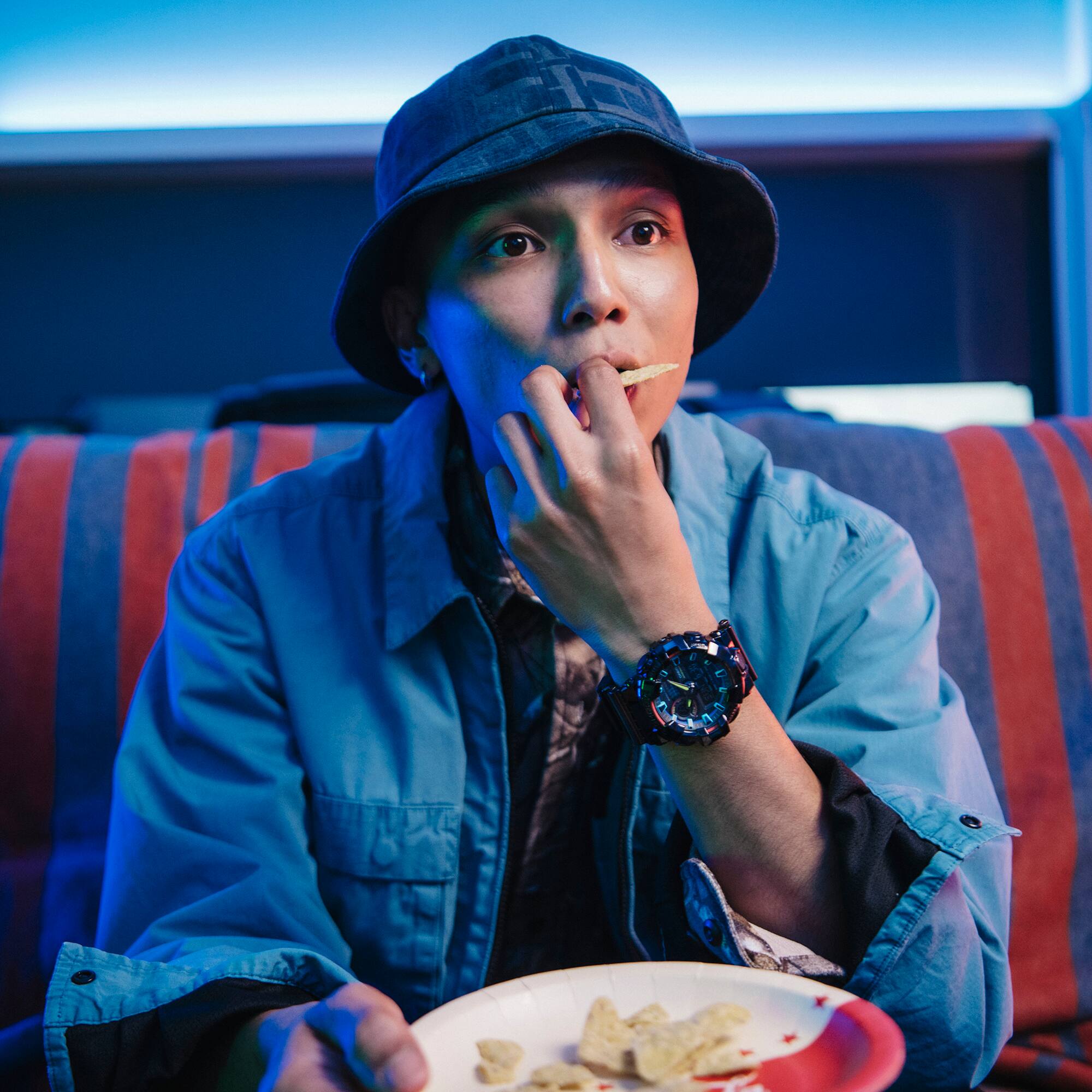 G-SHOCK RGB Gamer eating a snack will spectating a game