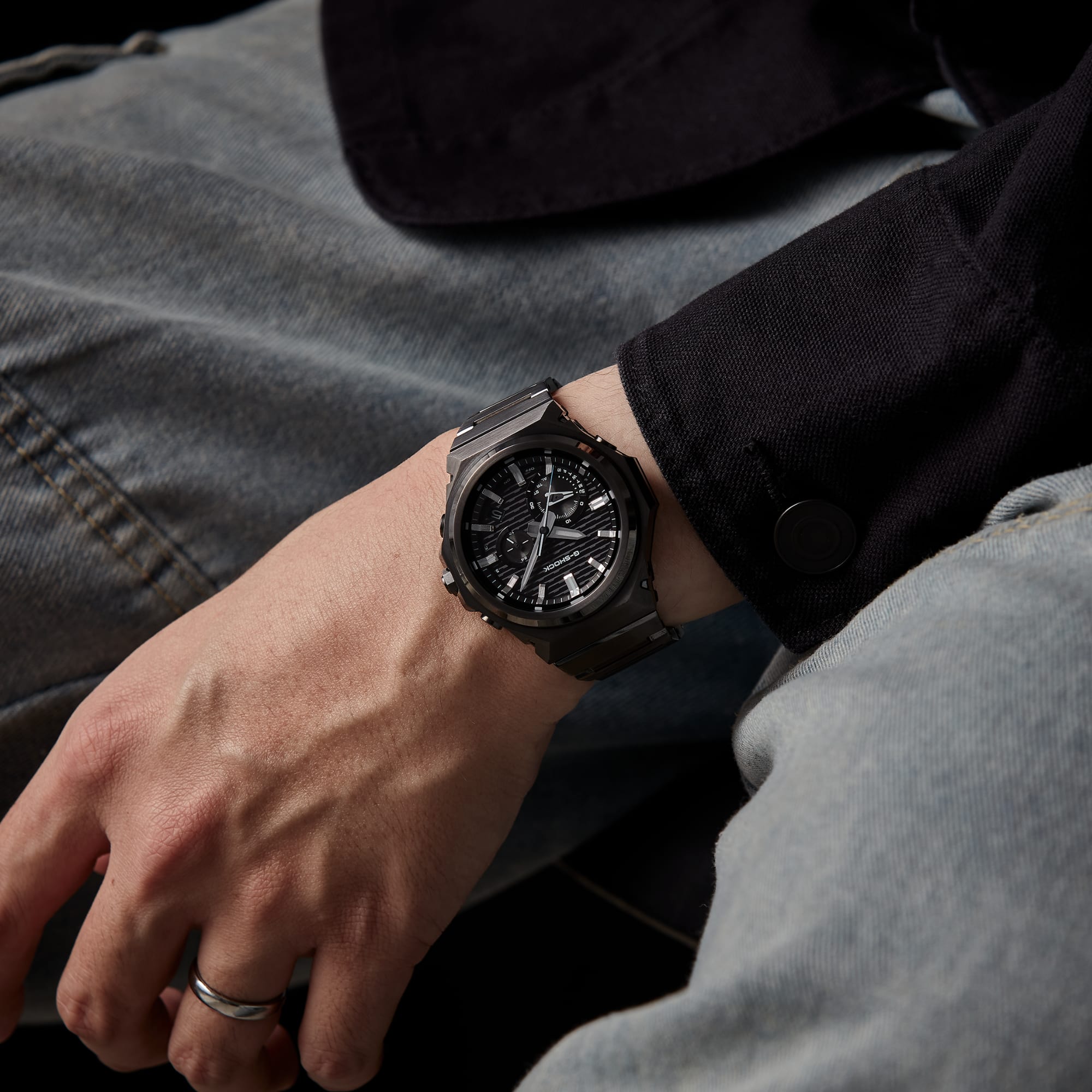 A photo of a man posing while wearing the GST-B1000BD-1