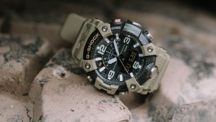 The Mudmaster model GG-B100BA-1AER by G-SHOCK and BURTON on a tire.