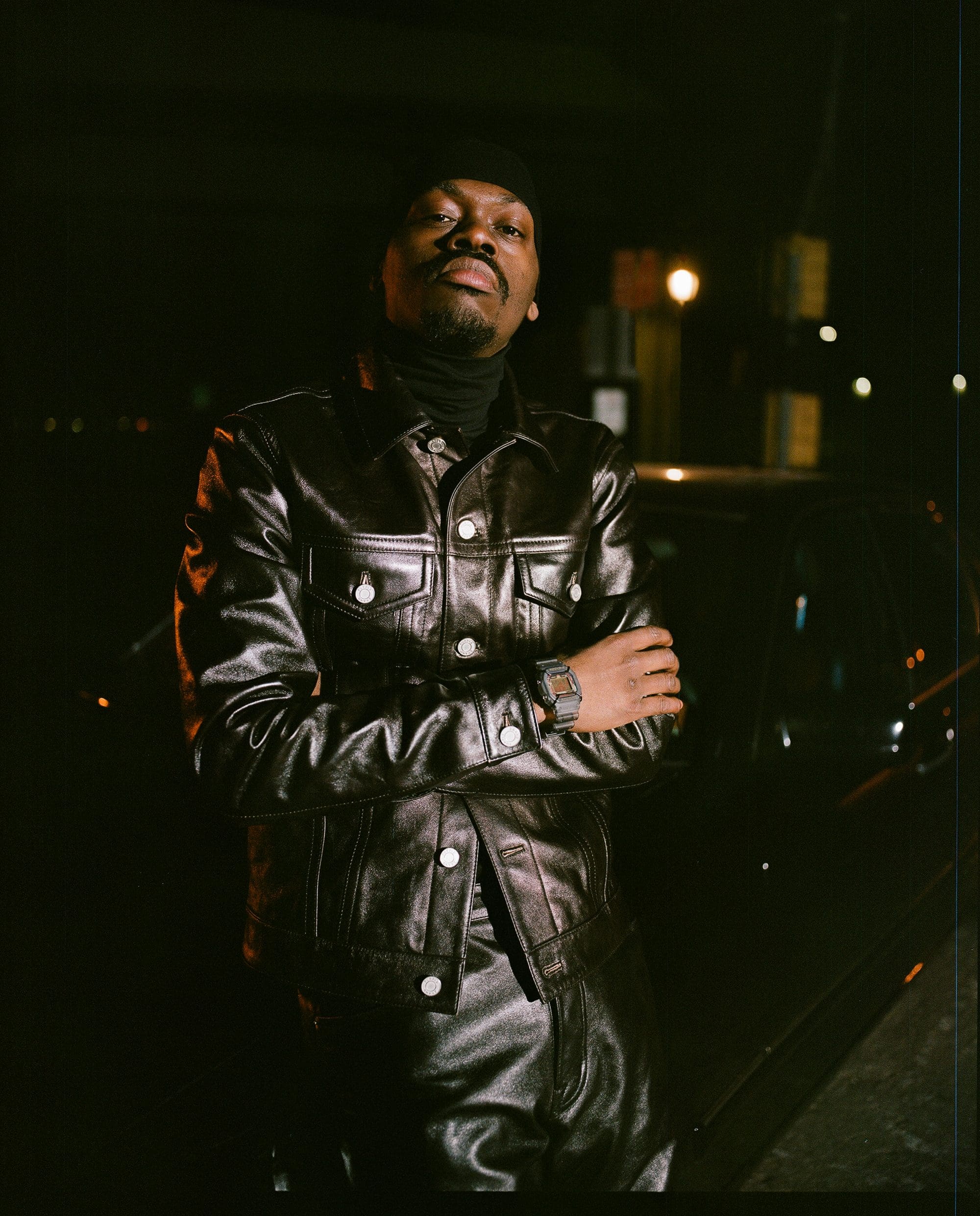 Man dressed in all black with arms crossed wearing Bodega DW5600BDG231 Man dressed in all black with arms crossed wearing Bodega DW5600BDG231