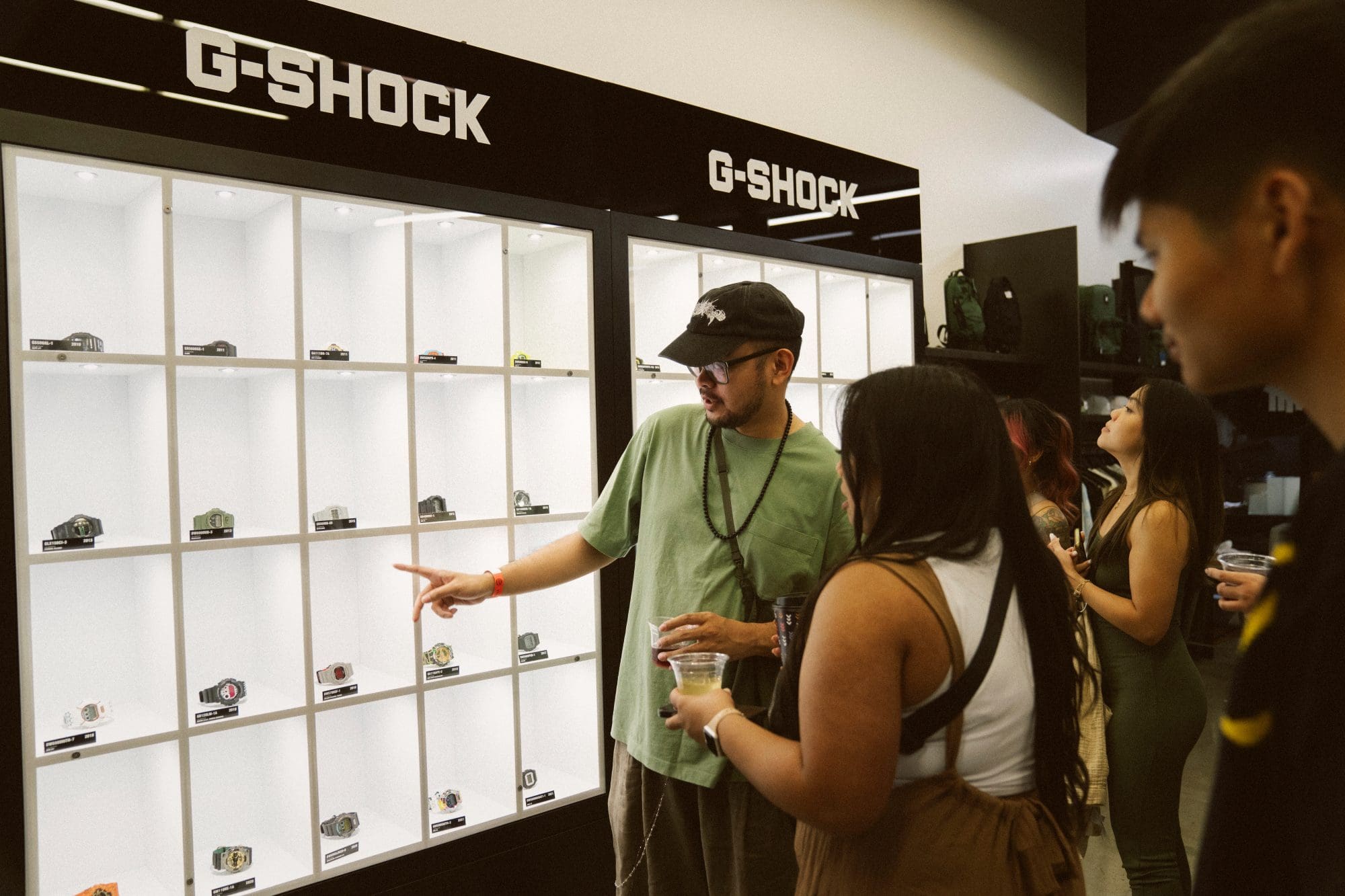 Attendees viewing G-SHOCK History Wall at the UNDEFEATED x G-SHOCK pre-launch event at UNDEFEATED Silver Lake Attendees viewing G-SHOCK History Wall at the UNDEFEATED x G-SHOCK pre-launch event at UNDEFEATED Silver Lake