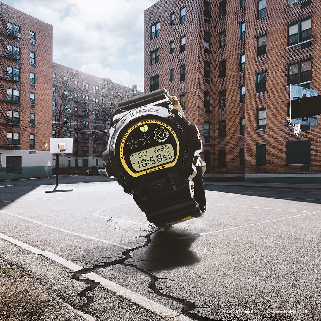 Wu-Tang watch in the foreground and NYC basketball court and apartment building in the background