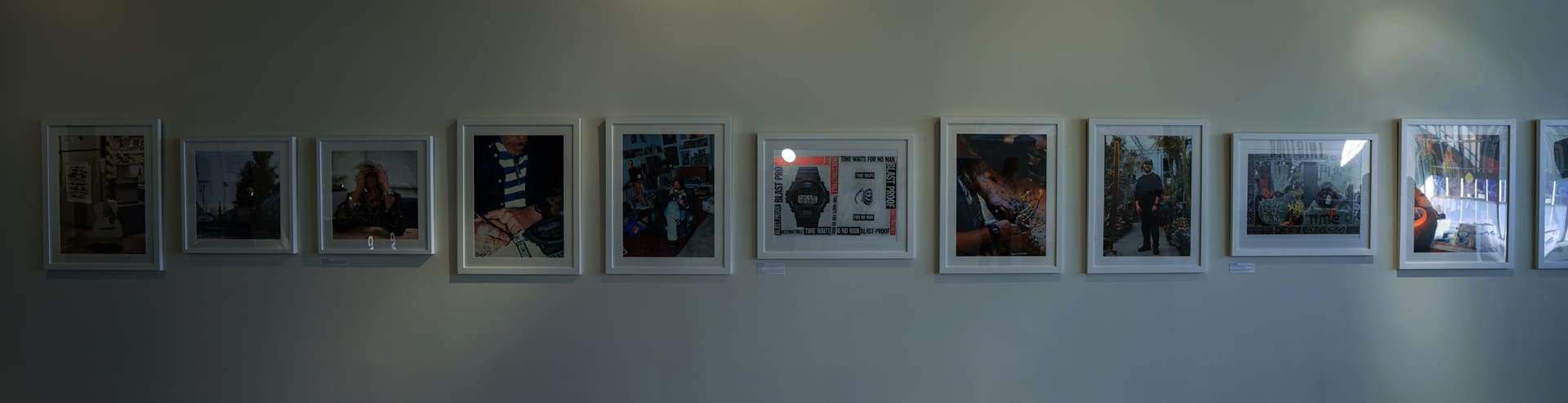A photo of multiple visuals from THISTIME magazine No. 2 hanging on the wall