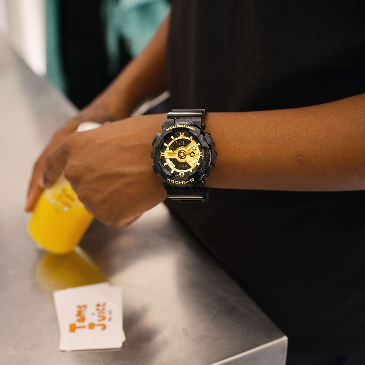 G-SHOCK GA110GB-1A on a man's wrist denoting G-SHOCK lifestyle.