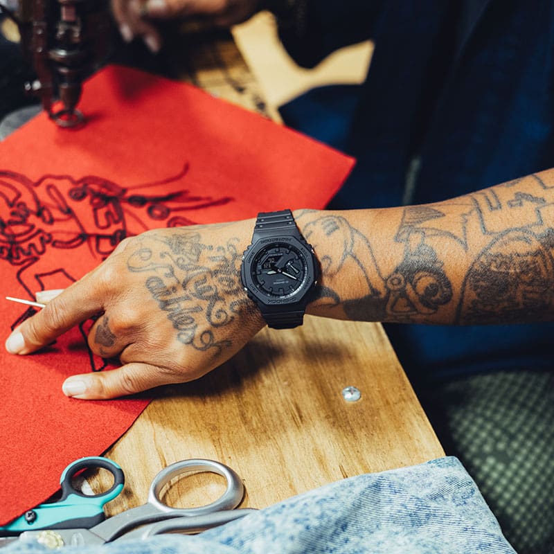 Racks Hogan working with fabric wearing a GA-2100-1A1