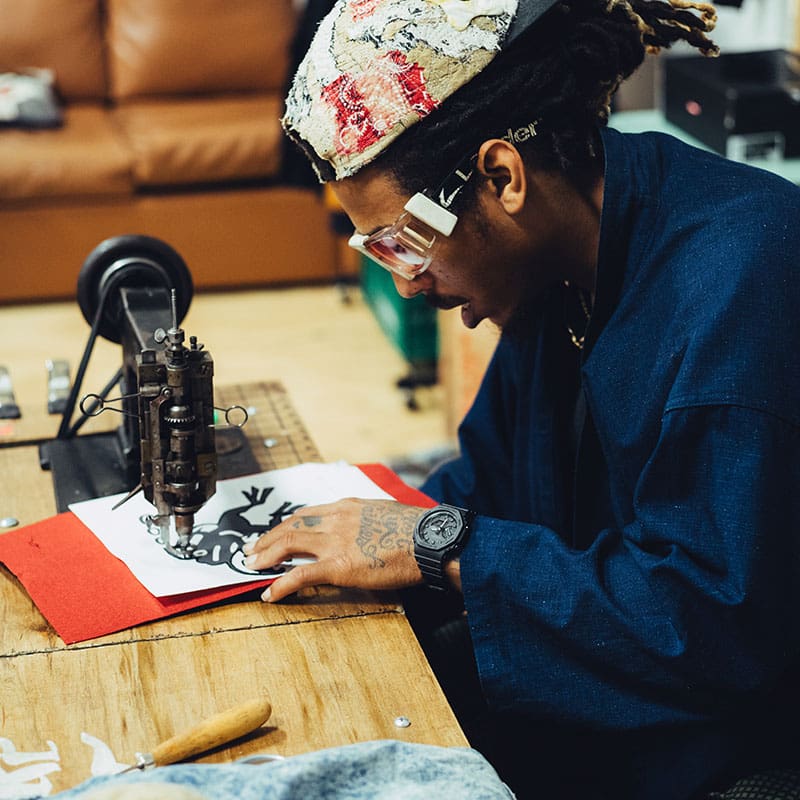 Racks Hogan working with a fabric pattern