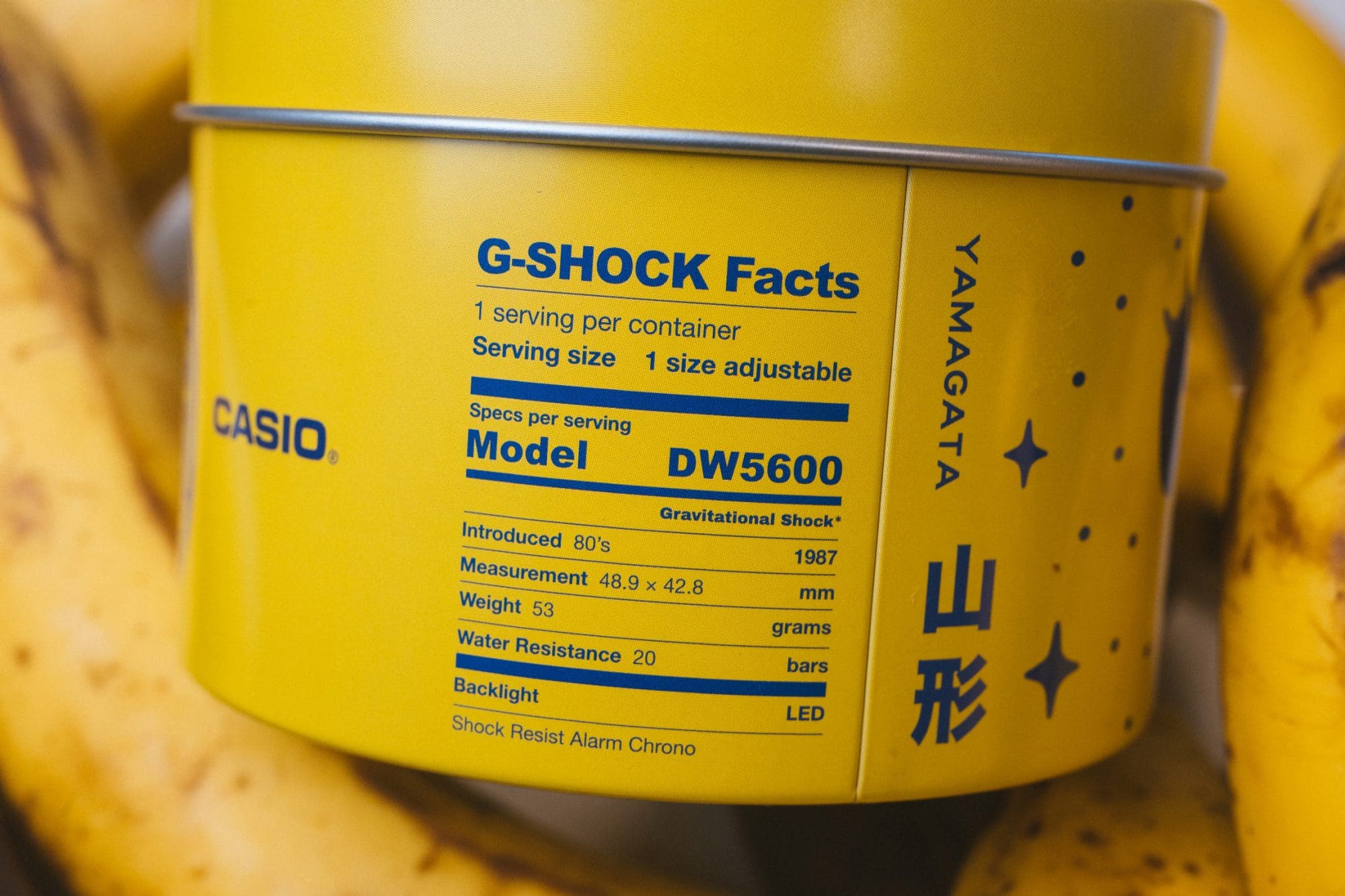 close up shot of G-SHOCK x TOYO TIRES DW5600TT25-1 special tin packaging