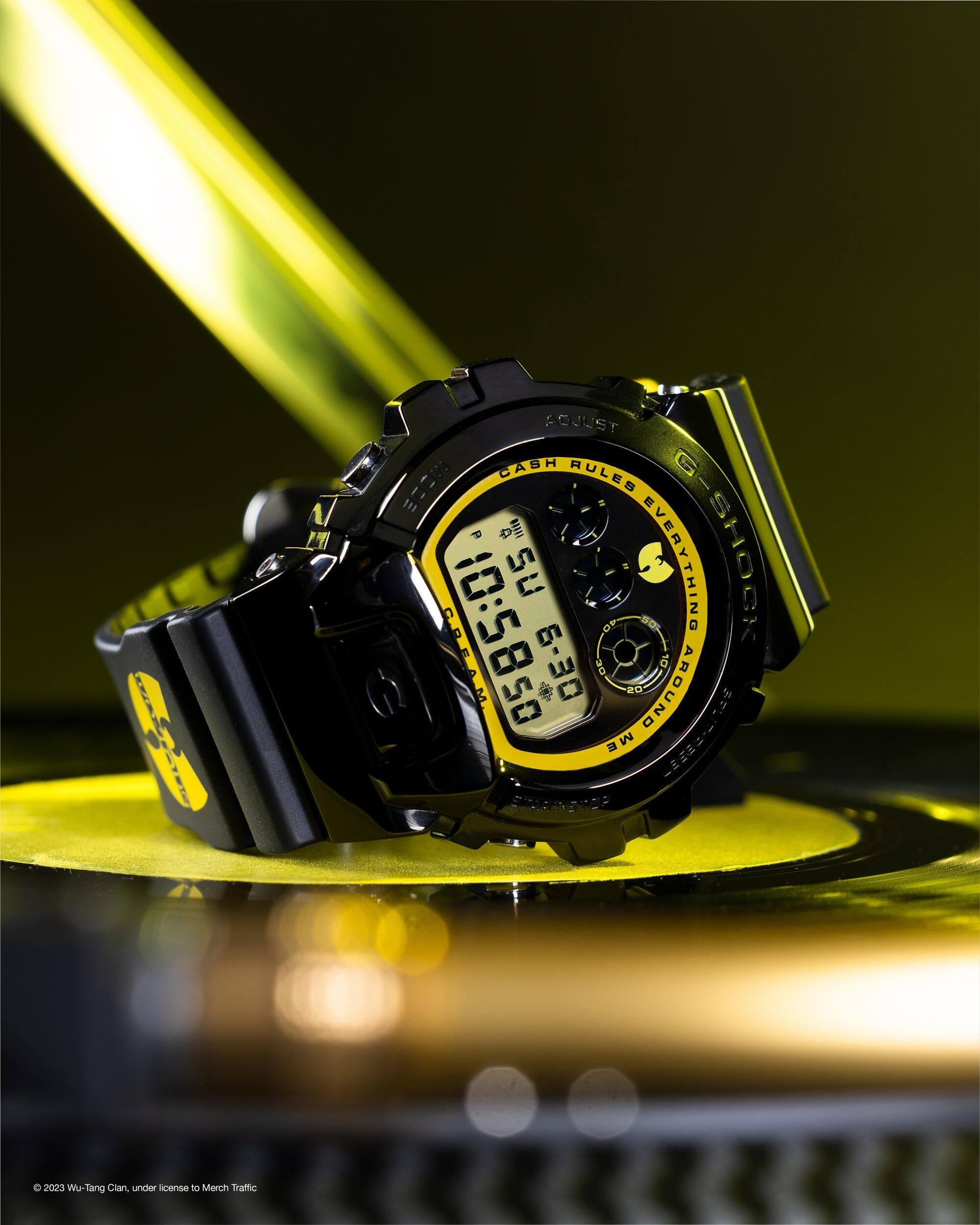 Wu-Tang watch laying on its side on a vinyl record