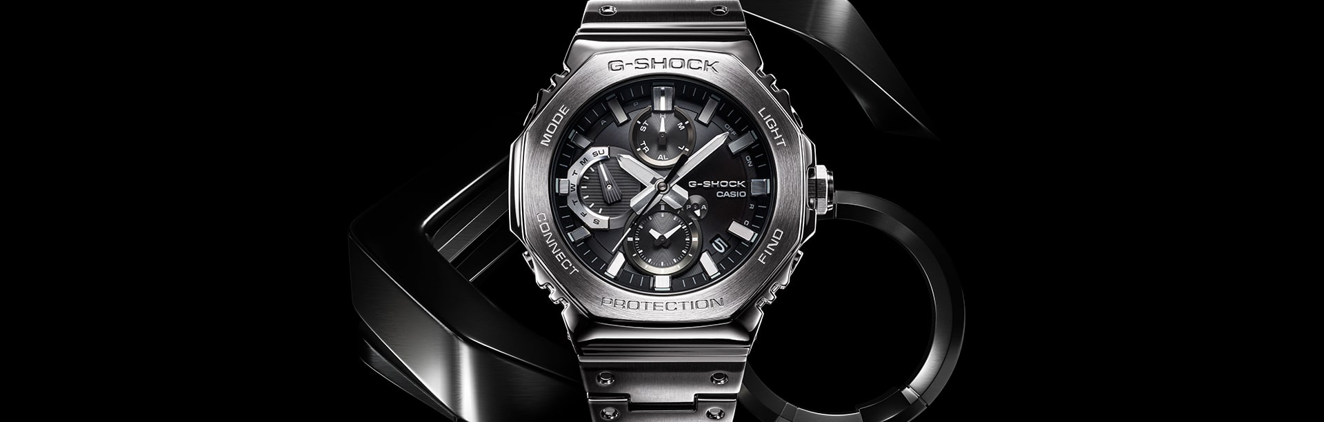 G-SHOCK GMCB2100D silver men’s watch against stylized metal background denoting style