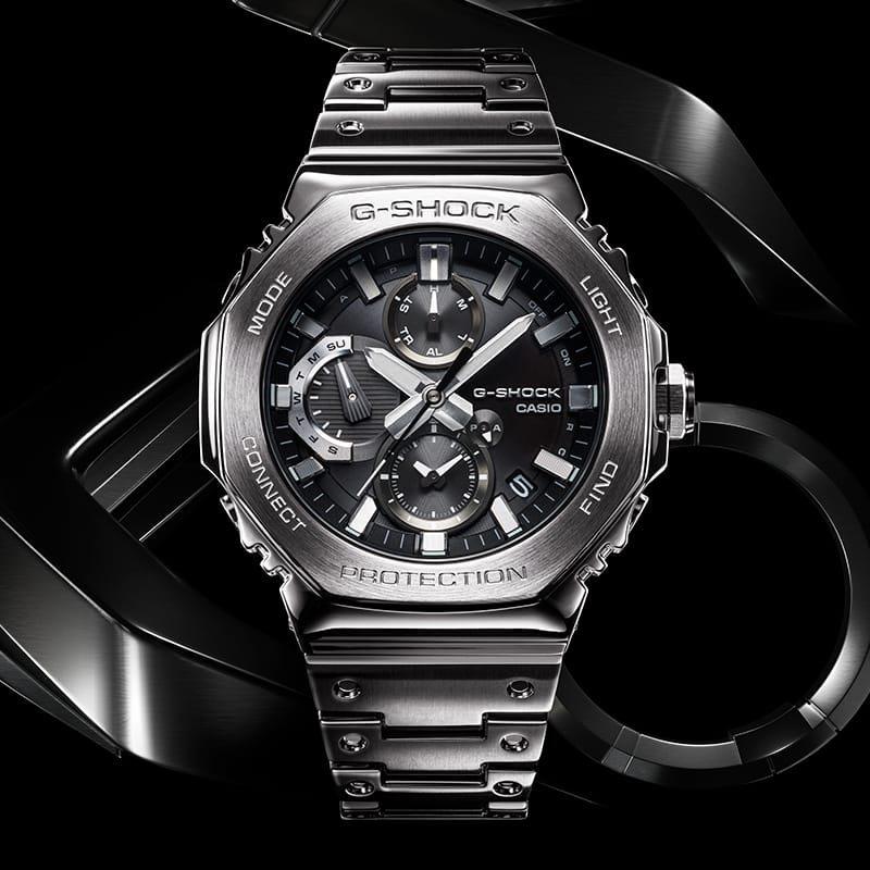 G-SHOCK GMCB2100D silver men’s watch against stylized metal background denoting style