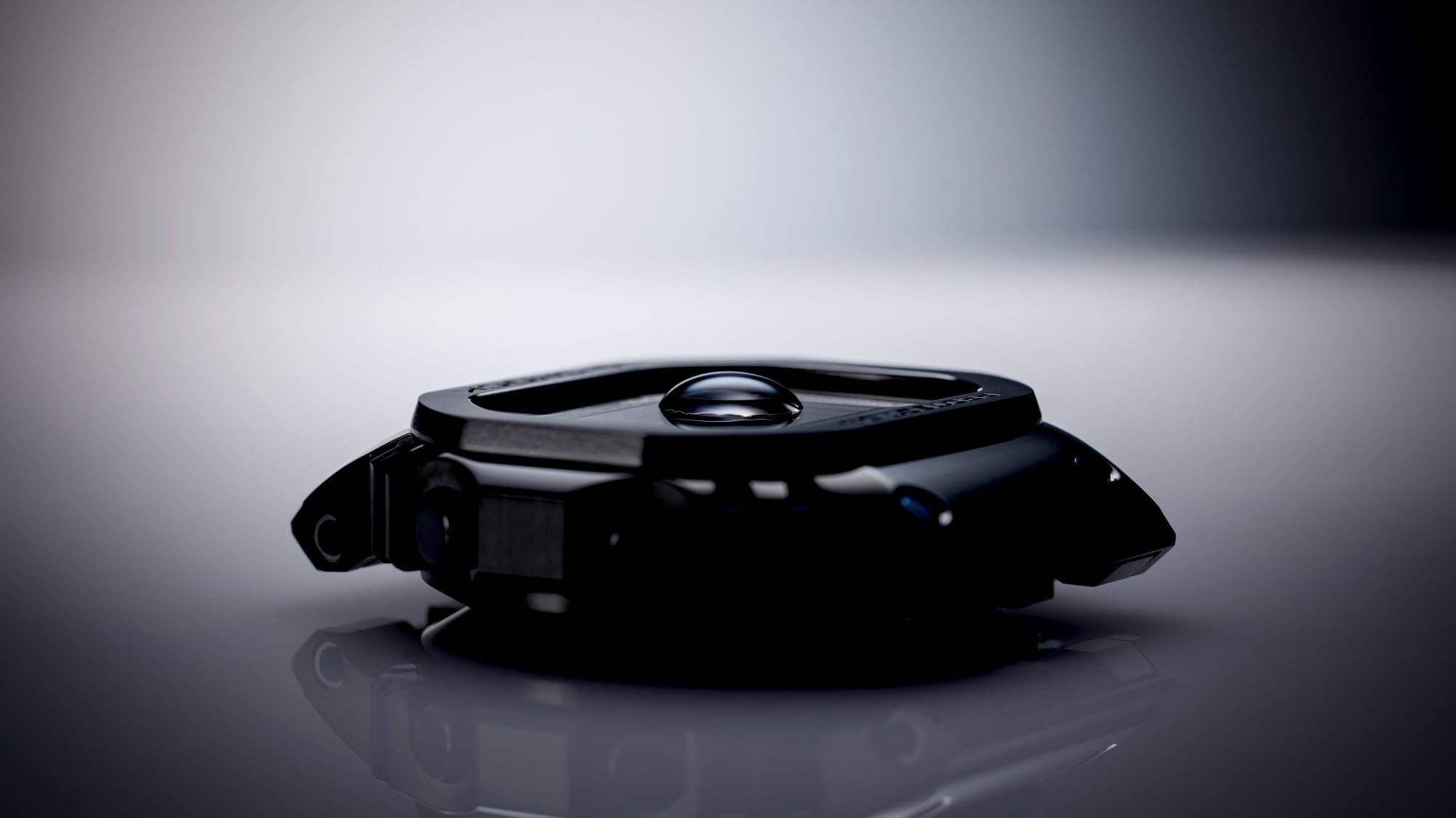 Watch case with water droplet sitting on the glass