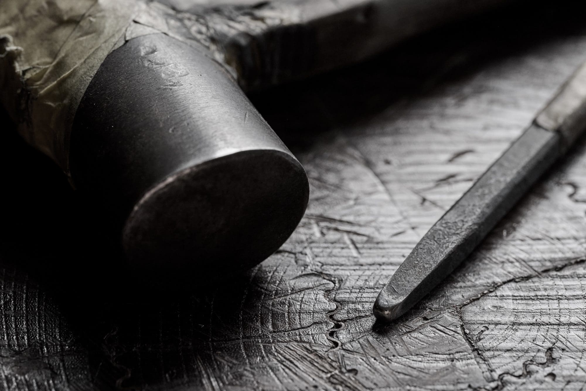 Photo of a hammer and chisel used for hand-hammering technique