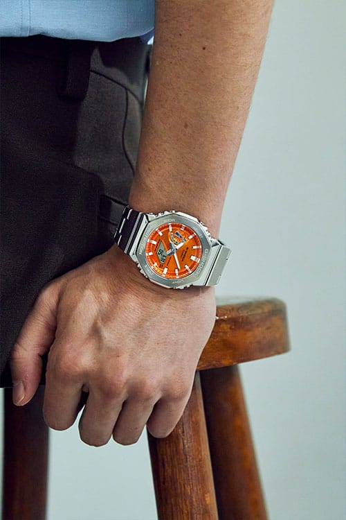 G-Shock Fashion Photo, Model wearing GM2110D-4A orange dialed analog digital watch