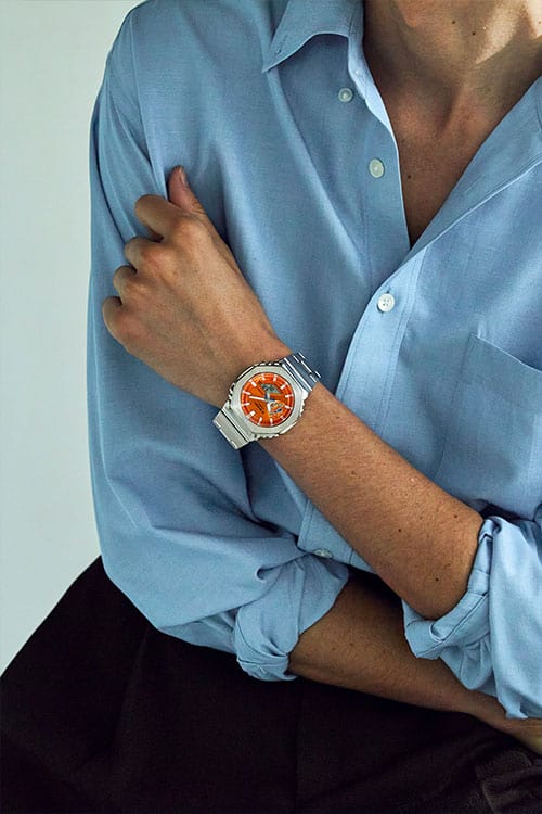 G-Shock Fashion Photo, Model wearing GM2110D-4A orange dialed analog digital watch