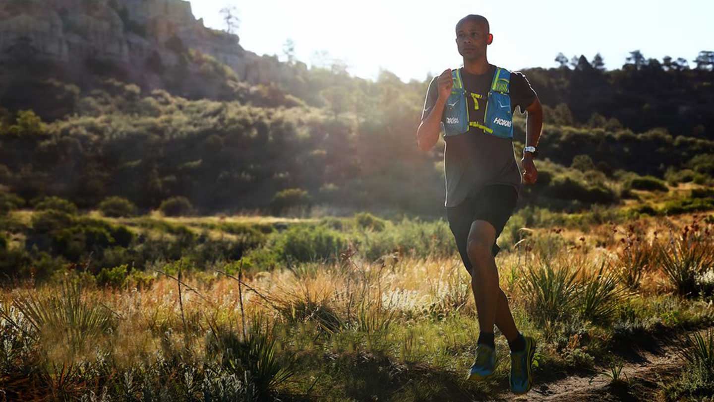 Mountain Runner Joseph Gray running down a dirt road wearing a G-SHOCK watch