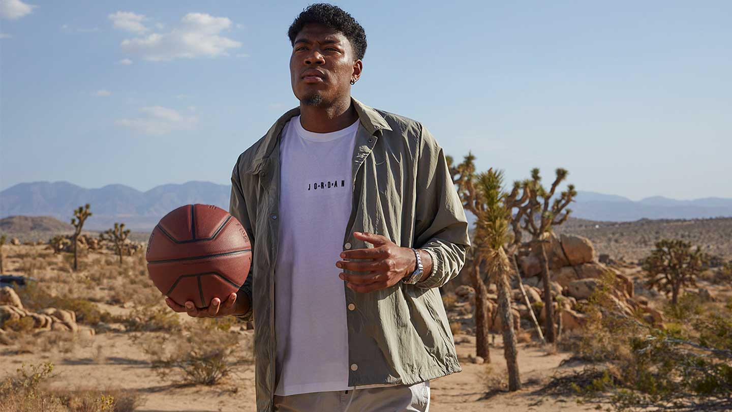 Rui Hachimura holding a basketball
