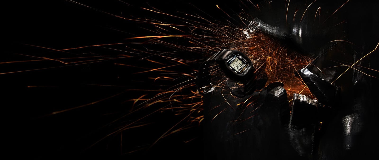 G-SHOCK watch amid sparks and metal denoting the toughness of G-SHOCK rugged watches