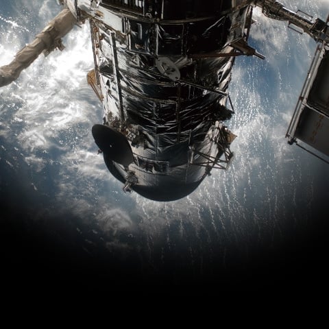 A satellite above the Earth denoting GPS time calibration signal reception for some G-SHOCK watches