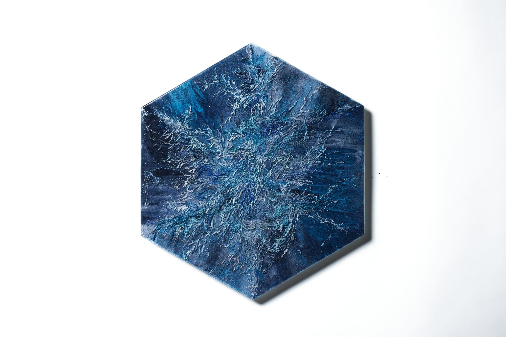 A photo of a hexagon blue painting from Water Mirror series.
