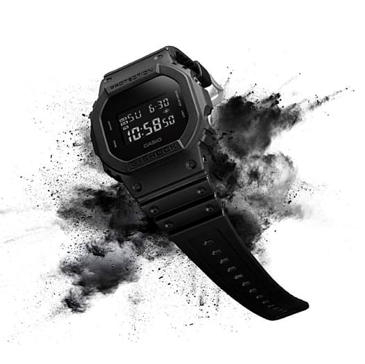 G-SHOCK DW-5600UBB-1 mil-spec watch with paint cloud aura denoting style.