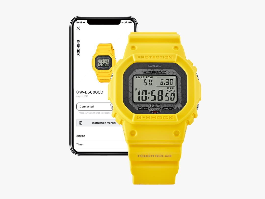 GW-B5600CD-9 Die Casio G-Shock GW-B5600CD-9 Bluetooth®-Uhr vor einem Smartphone, auf dessen Display Informationen zur Uhr zu sehen sind