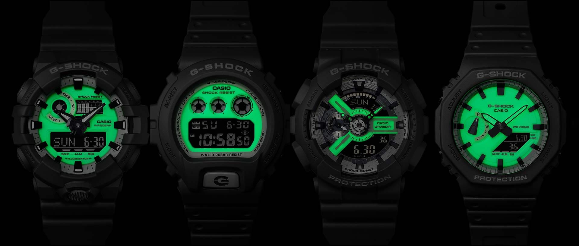 Vier Casio G-Shock Armbanduhren mit leuchtenden Zifferblättern im Dunkeln