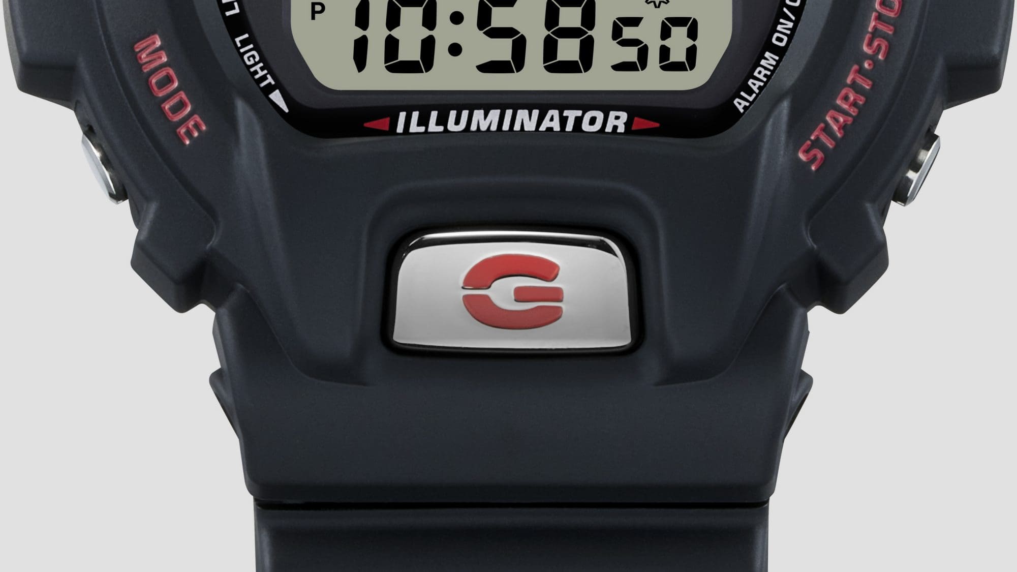 Frontknopf des DW-6900 Modells aus Metall mit einem roten „G“ darauf