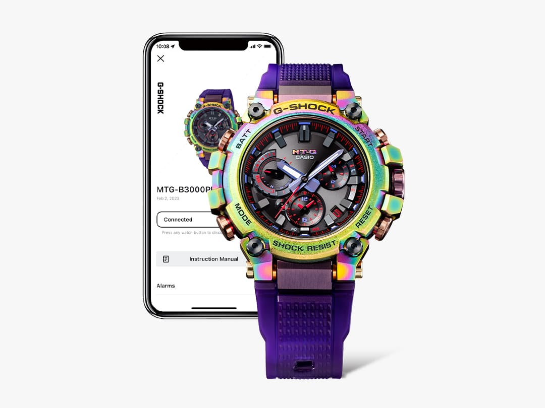 Die MTG-B3000 Armbanduhr vor einem Smartphone auf dem die CASIO WATCHES App zu sehen ist