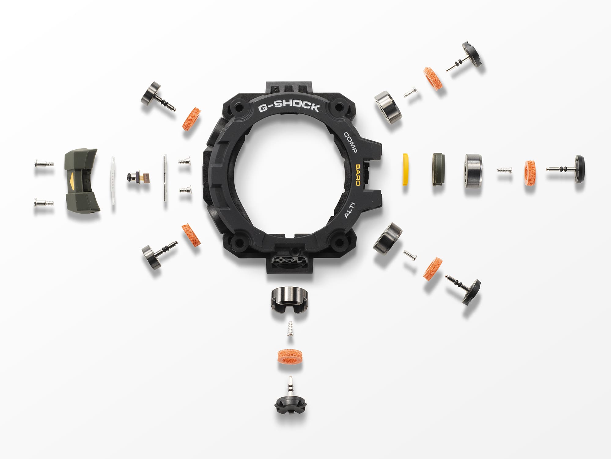 Die schwarze Lünette einer GW-9500 Armbanduhr, umgeben von ihren Einzelteilen wie Knöpfen, Schrauben und Dichtungen