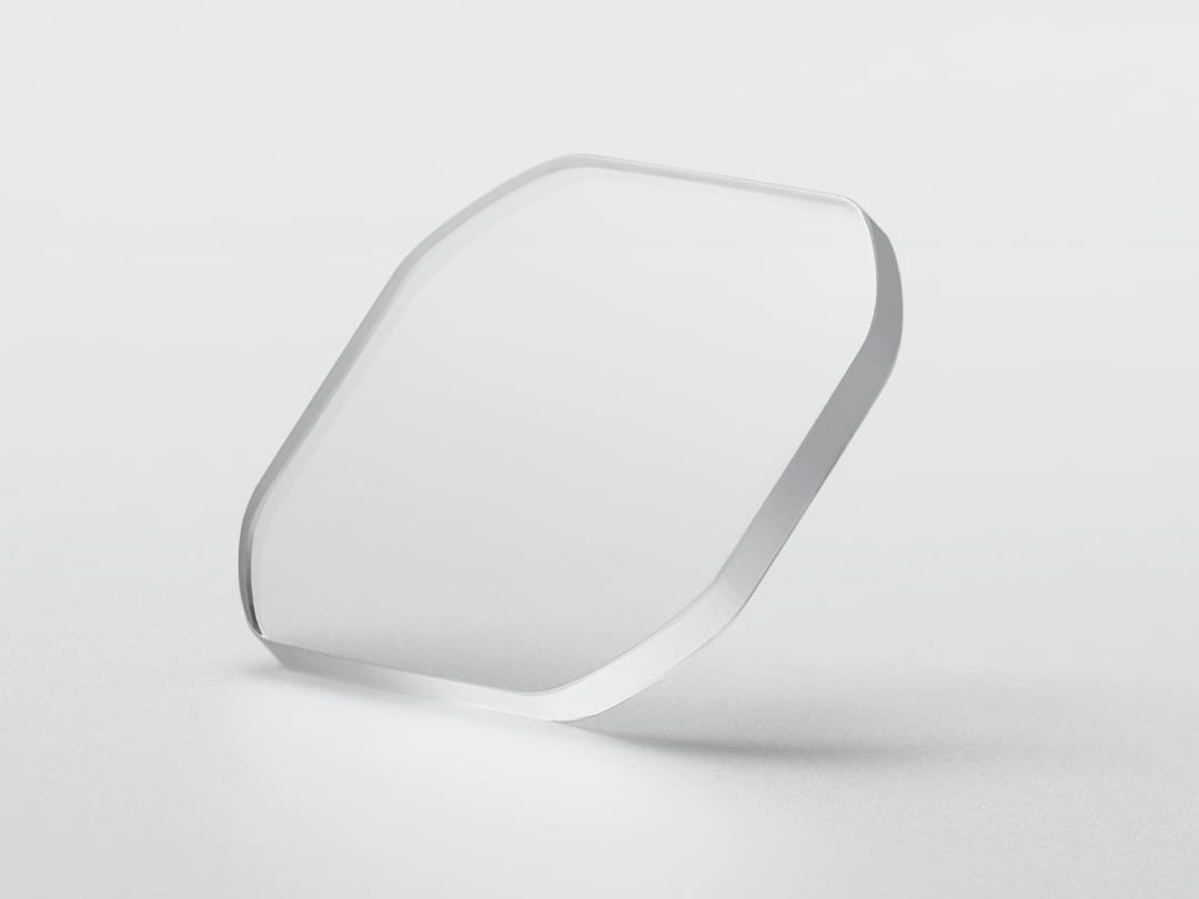 An octagonal sapphire crystal pane against a light grey background