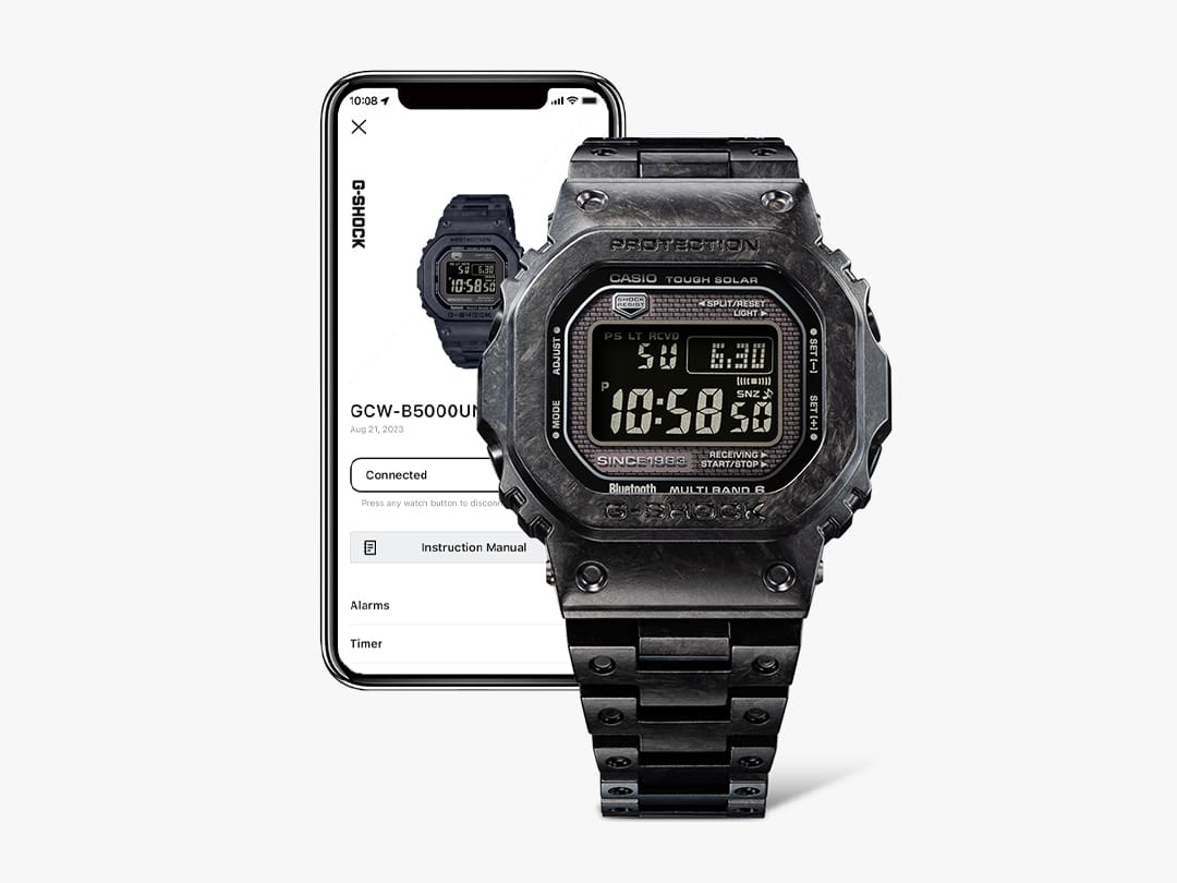 The GCW-B5000UN-1 Bluetooth® watch in front of a smartphone with information about the watch on the display