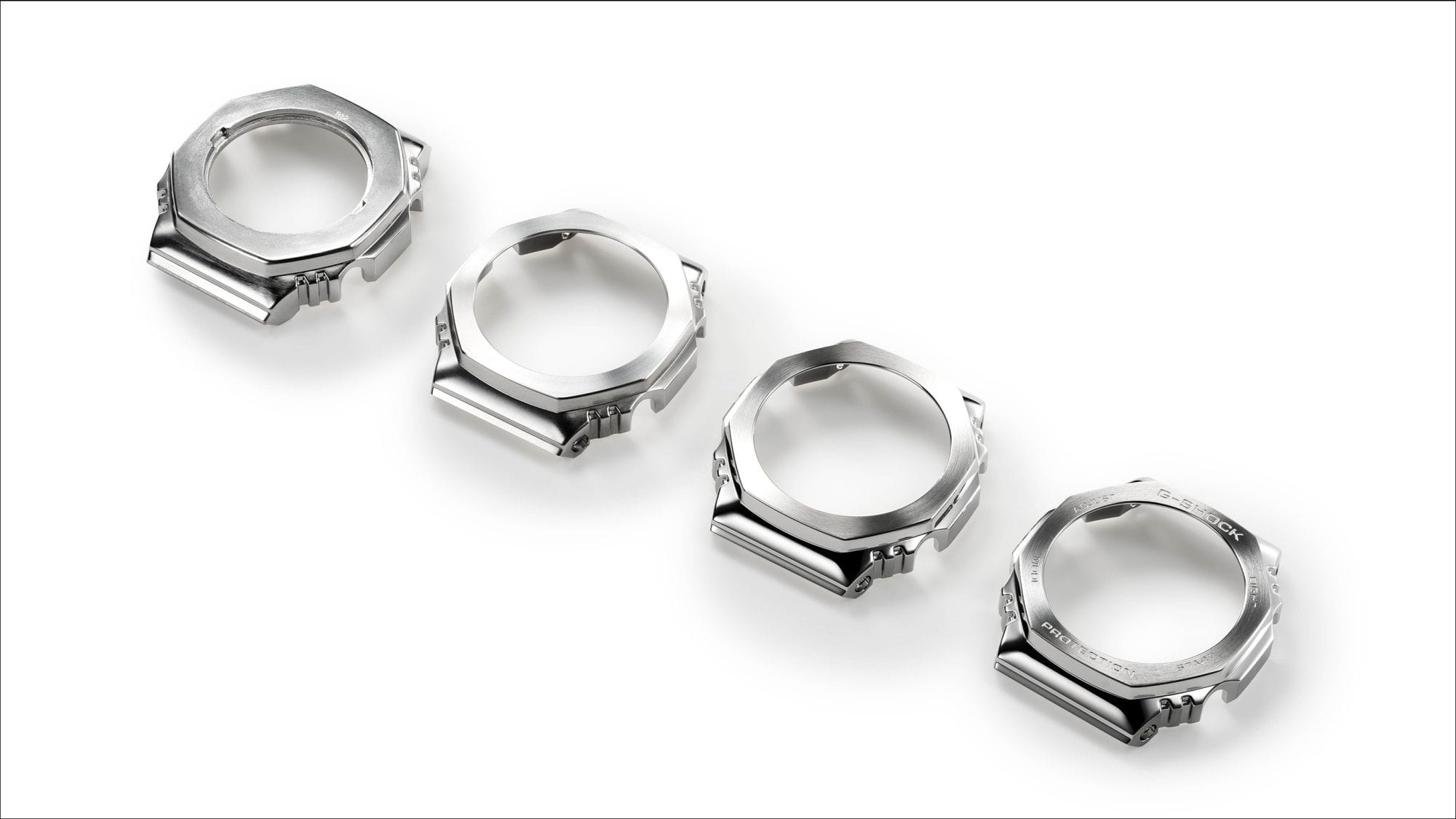 Four silver-coloured bezels, each subtly different from the next