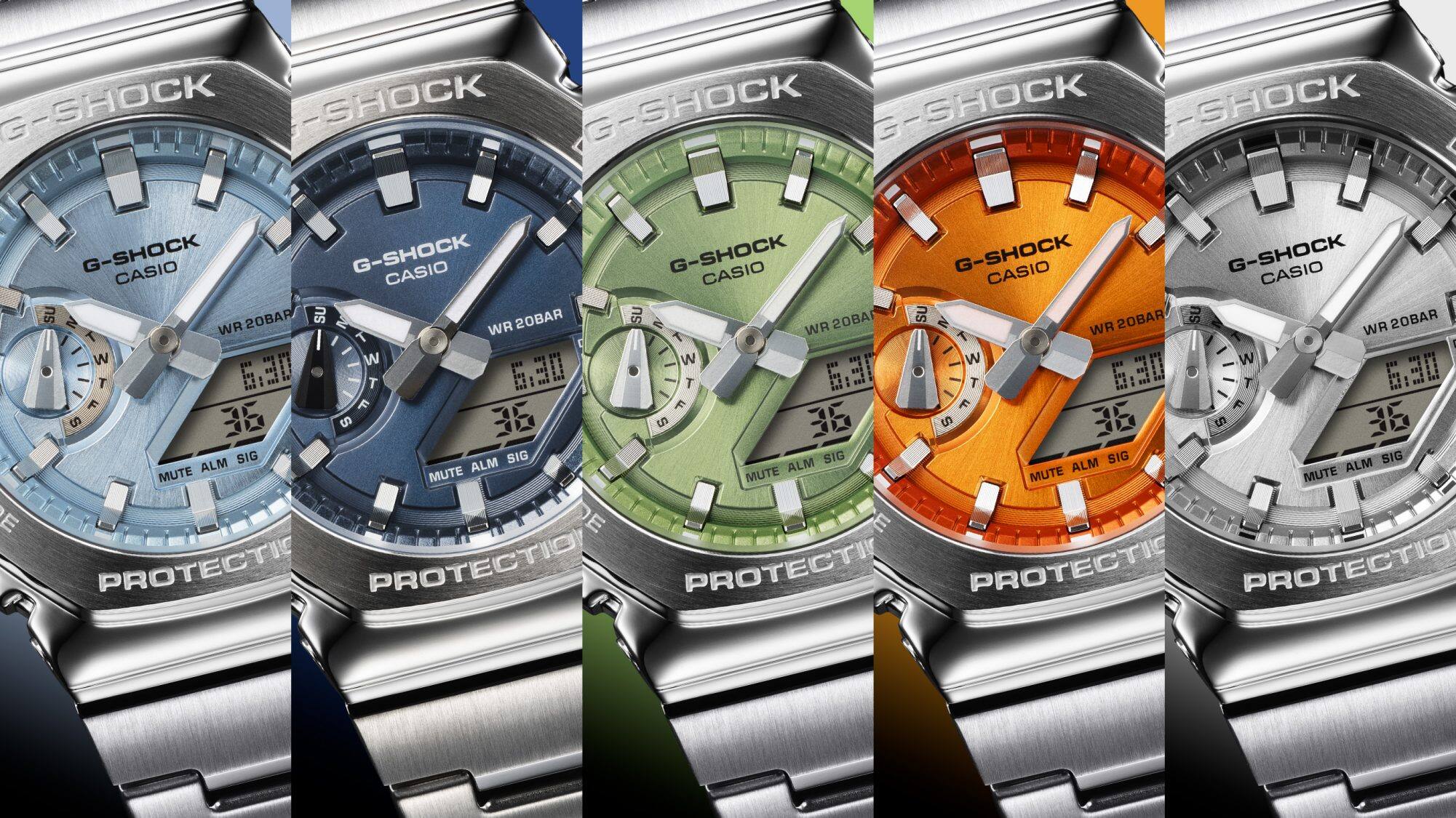 The five colour variants of the Casio G-Shock GM-2110D series next to each other: the GM-2110D-2A with a light blue dial, the GM-2110D-2B with a dark blue dial, the GM-2110D-3A with a green dial, the GM-2110D-4A with an orange dial and the GM-2110D-7A wristwatch with a silver-coloured dial