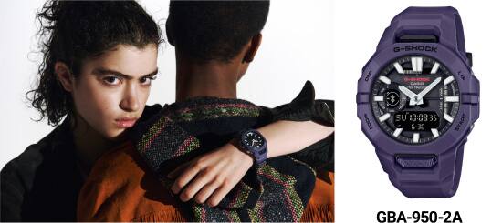 A woman wearing the purple G-SHOCK GBA-950 analog watch hugging a man. Next to it is a product shot of the watch with green shimmering details